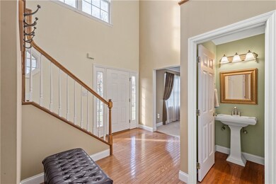 The 2 Story hardwood foyer features a turned stair