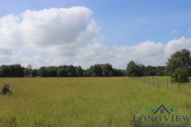 View of wooded area featuring a rural view