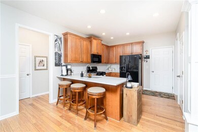 Well lit spacious kitchen. Perfect peninsula for entertaining.