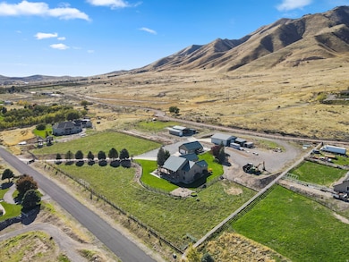 Aerial view of this 5.02 Acre property's location with a mountainous background.