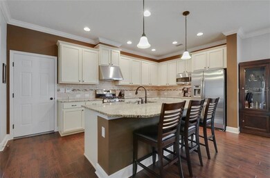 Large kitchen island, vented hood, stainless steel
