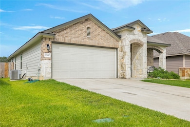 View of front of property with driveway, an attach