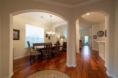 34 S Dylanshire Cir A beautiful foyer welcomes you home. This flooring is engineered acacia wood. The same kind of wood was referenced in the Bible!