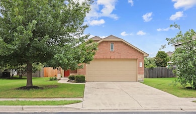 View of front of home with brick siding, concrete