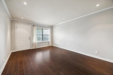South facing living room.  Gorgeous wood floors.