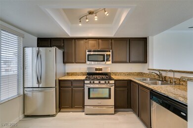 Kitchen with stainless steel appliances, a sink, o