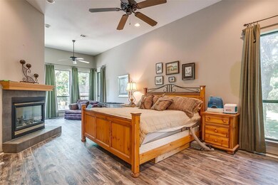 Primary Bedroom with gas fireplace and sitting area.