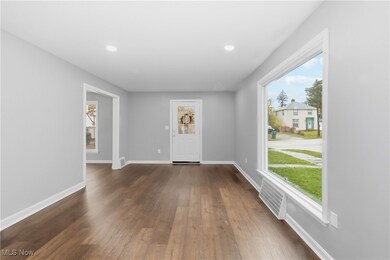 Foyer entrance featuring dark wood-type flooring and recessed lighting