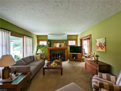 Expansive Living Room with Beveled Glass Transoms