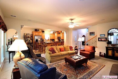 The entry leads to the family room with stairs to
