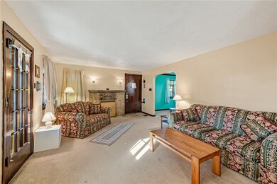 Step into the large living room that opens onto the large side porch.