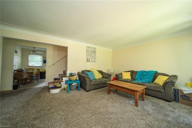 Living room looking into the kitchen and staircase