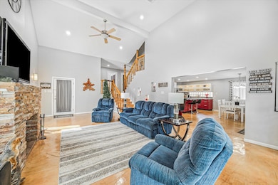 Living room opens to dining and kitchen.