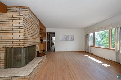 Living room with wood floors and fireplace