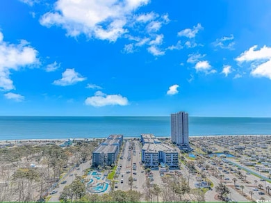 Drone / aerial view with a water view and a city v