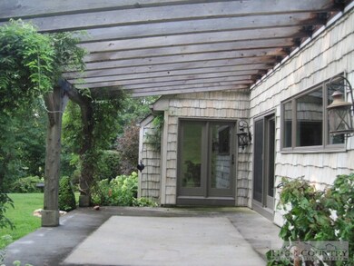 Patio/Arbor: Large open patio accesses the kitchen