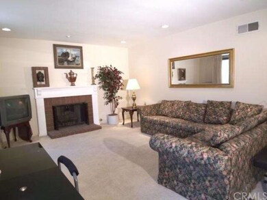 Large living room with scraped ceilings, canned li