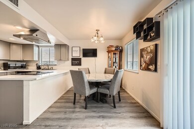 Dining area with baseboards, wood finished floors,