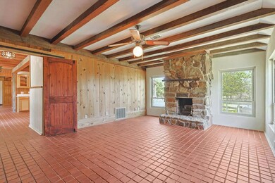Great Living room featuring wooden walls, beam cei