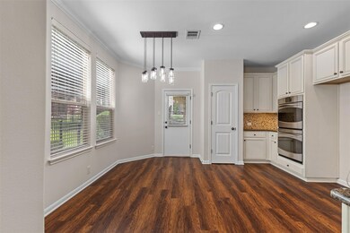 Kitchen featuring decorative backsplash, pendant 
