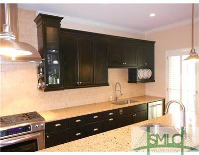 Kitchen. CENTER ISLAND WITH ADDITIONAL SINK AND ST