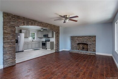 Large Living Room with Stunning Stone wood burning Fireplace!