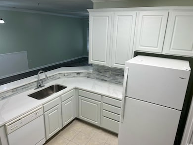 Laundry area featuring crown molding, a sink, and 