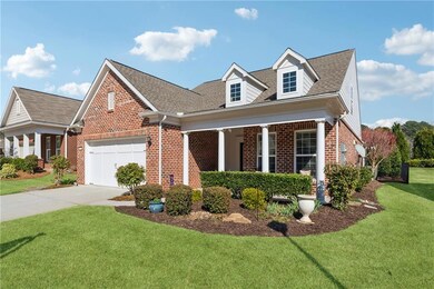View of front facade with driveway, an attached ga
