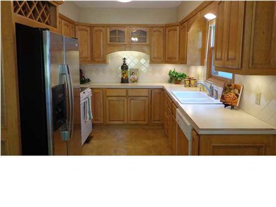 Kitchen includes the stainless refrigerator, range