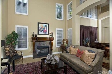 formal living room with custom fireplace