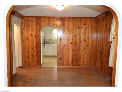 Unique arched open doorways to Kitchen and Bedroom