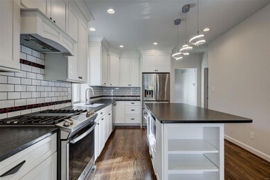 Updated kitchen with black pearl suede granite top