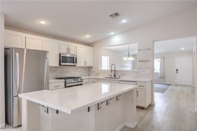 Kitchen featuring appliances with stainless steel