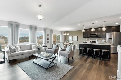 Living room featuring a chandelier, dark wood-style floors, recessed lighting, and lofted ceiling