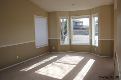 Living room w/ bayed window & possible second dini