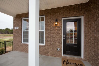Large front porch to enjoy your morning coffee!  Photo of decorated model home.