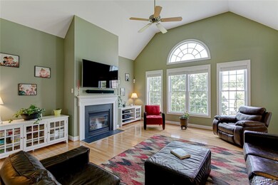 Spacious gathering area with hardwood floors, ceil