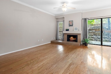 Unfurnished living room with wood finished floors