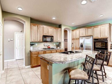 Kitchen. Built in double ovens, stainless fridge a