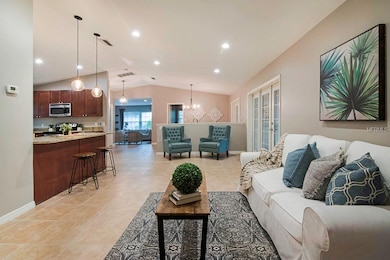 View of the living area with the kitchen, dining, 