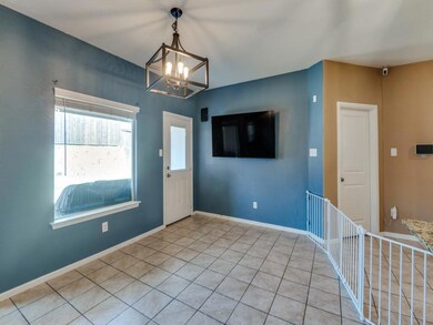 Foyer entrance featuring light tile patterned floo