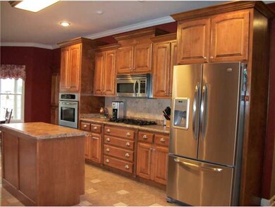 Stainless appliances stay. This big kitchen will m