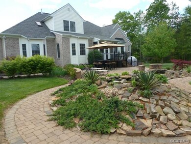 Rear View of Home. Brick Patio, 2 Tier Koi Pond, S