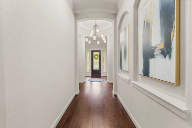 Another view of the entry and long hallway where t
