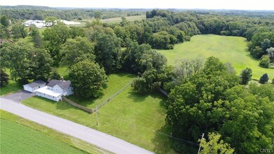 Part of the five acres goes behind the house with