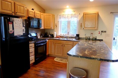 Open kitchen/dining/living area with...