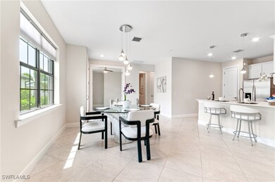 Dining space featuring baseboards, light tile patt