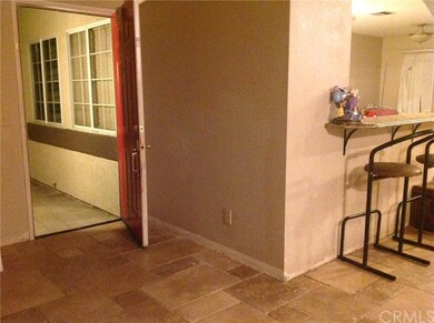 Front Door, travertine floors in traffic ares