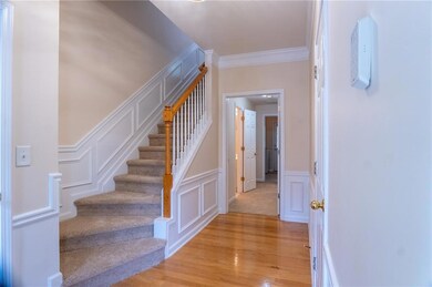 Staircase with a decorative wall, wood finished fl