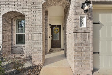 Grand entry with gorgeous landscaping.